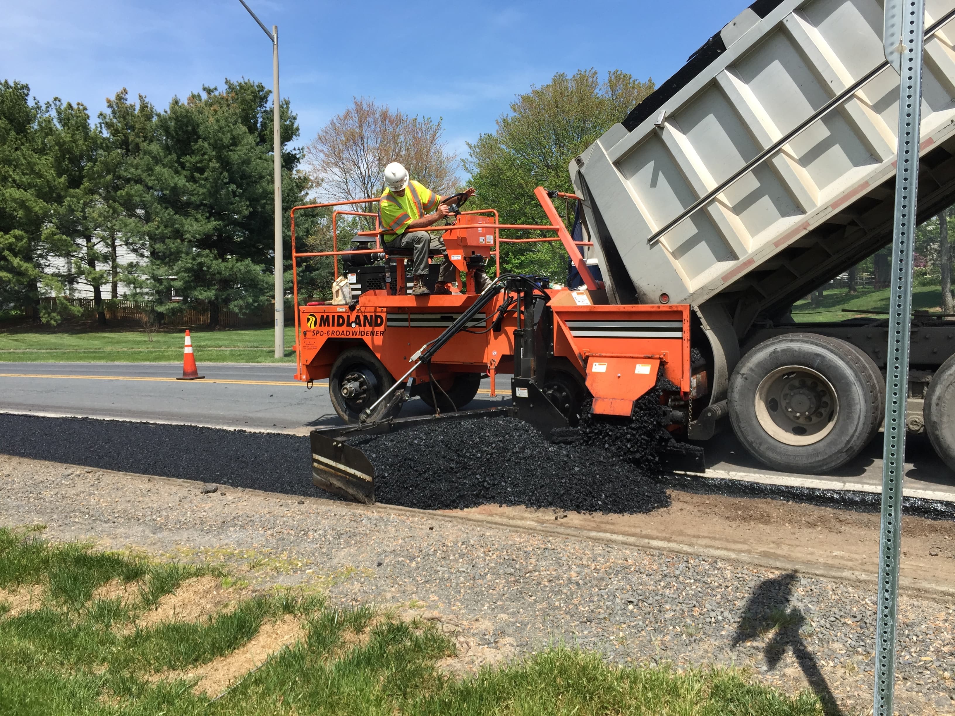 Commercial paving project with heavy asphalt equipment